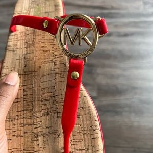 Red Michael Kors flip-flops